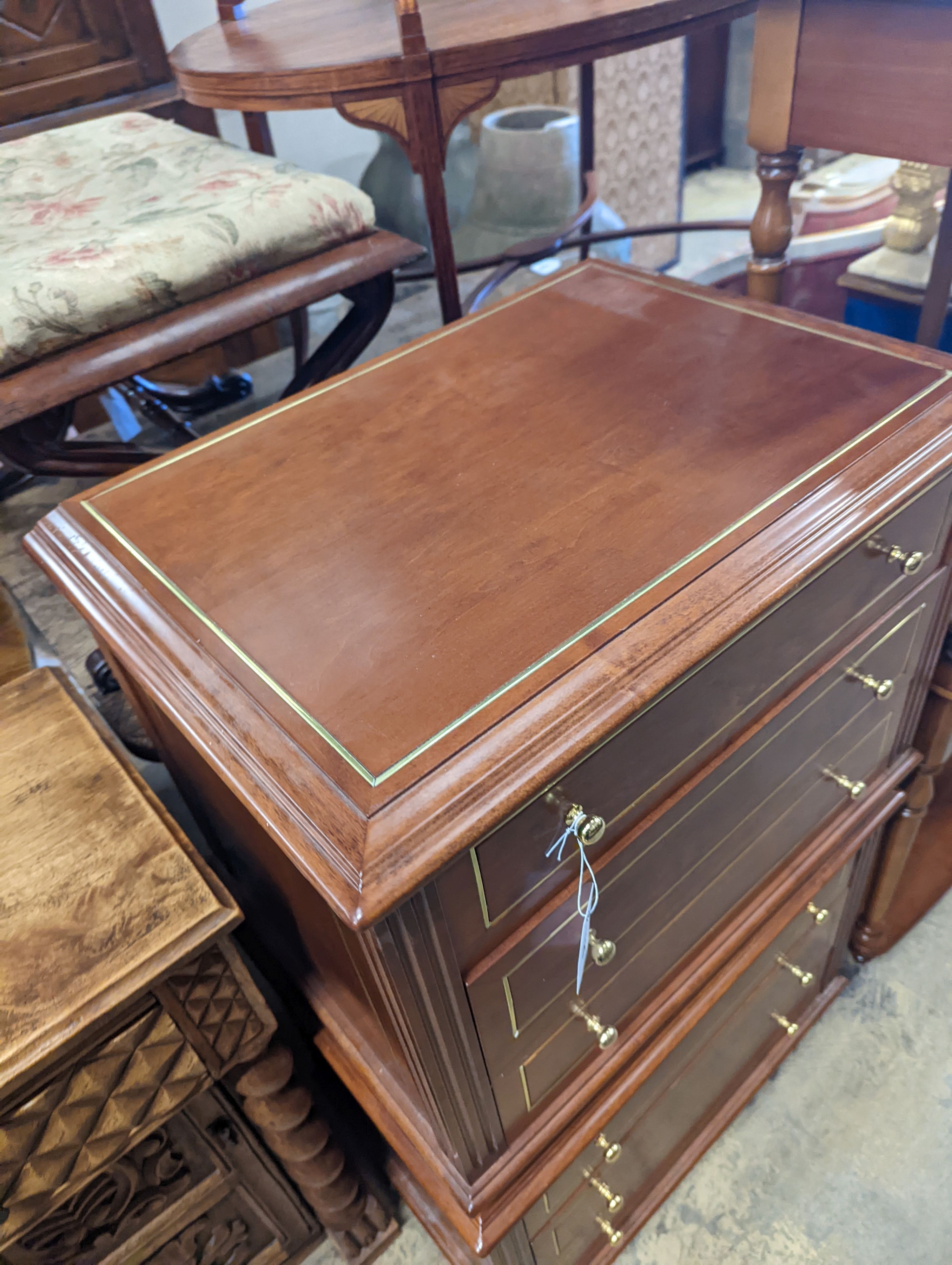 A pair of contemporary brass inlaid cherry bedside chests, width 65cm, depth 45cm, height 50cm